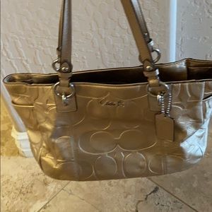 Used Coach gold tote plus wristlet